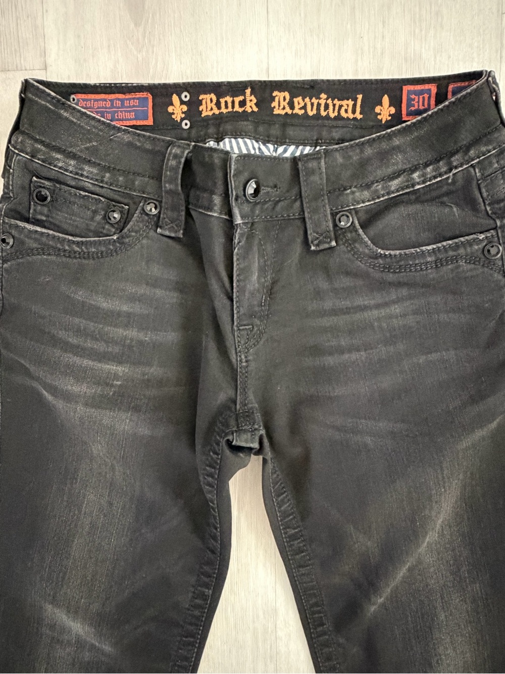Rock Revival Women’s Black Slim Straight Jeans with Faded wash.